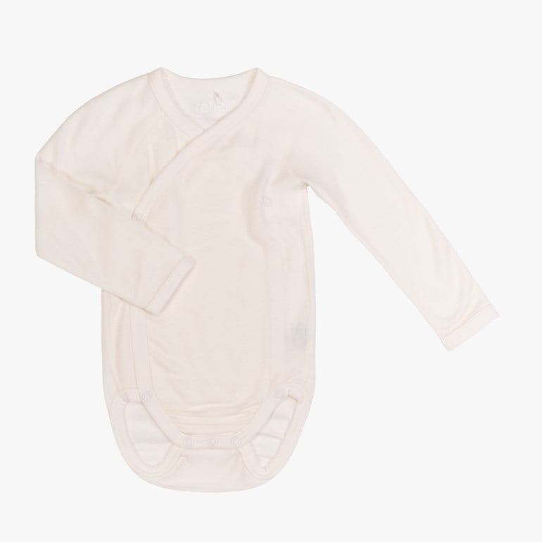 Hvit langermet omslagsbody til baby med trykknapper.