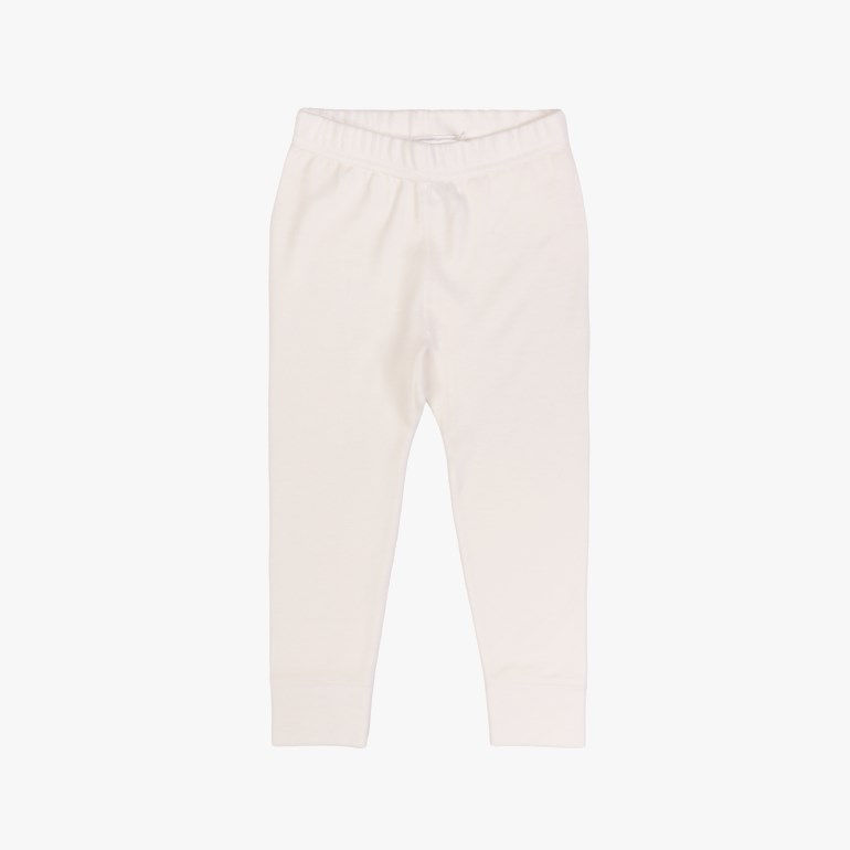 Forfra hvite barne-leggings med elastisk linning og ribbestrikkede mansjetter.