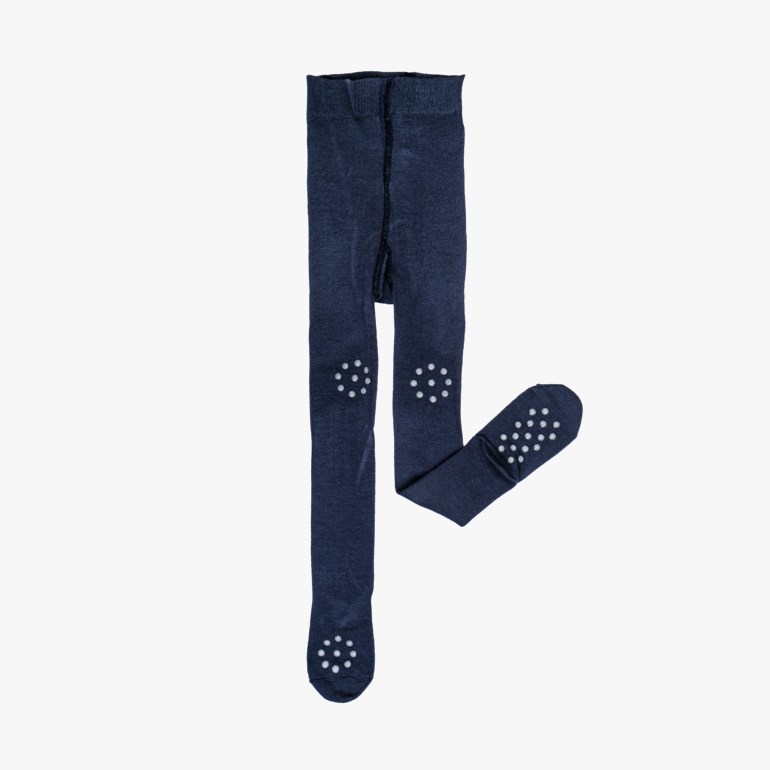 Mørkeblå barnestrømpebukse med hvite anti-skli prikker på knærne og føttene.