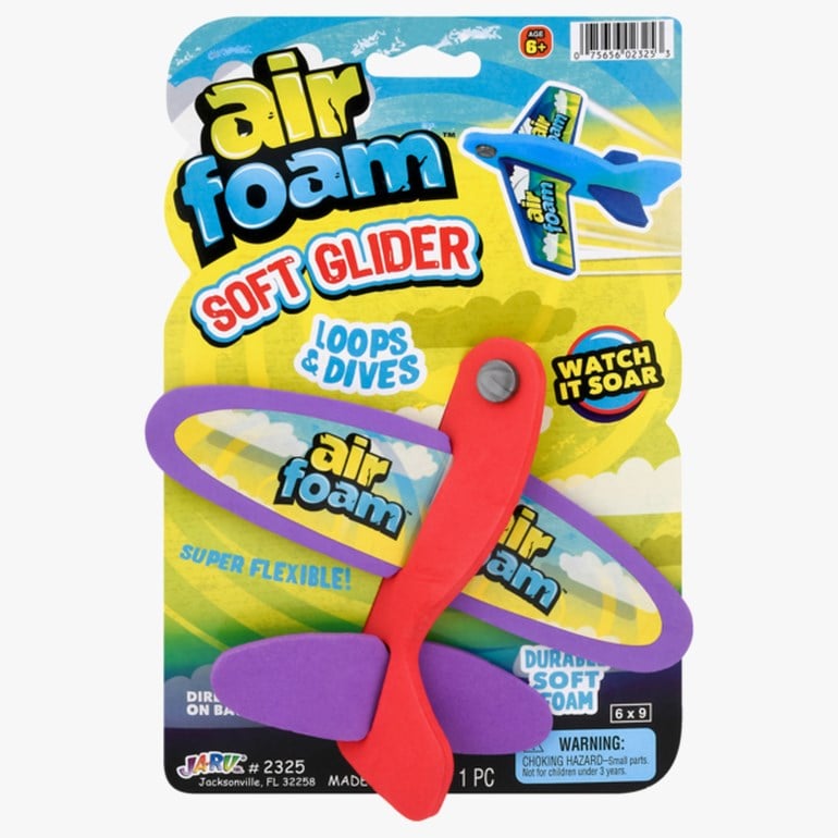 Et pakket Air Foam Soft Glider lekefly, med rød kropp og lilla skumvinger.