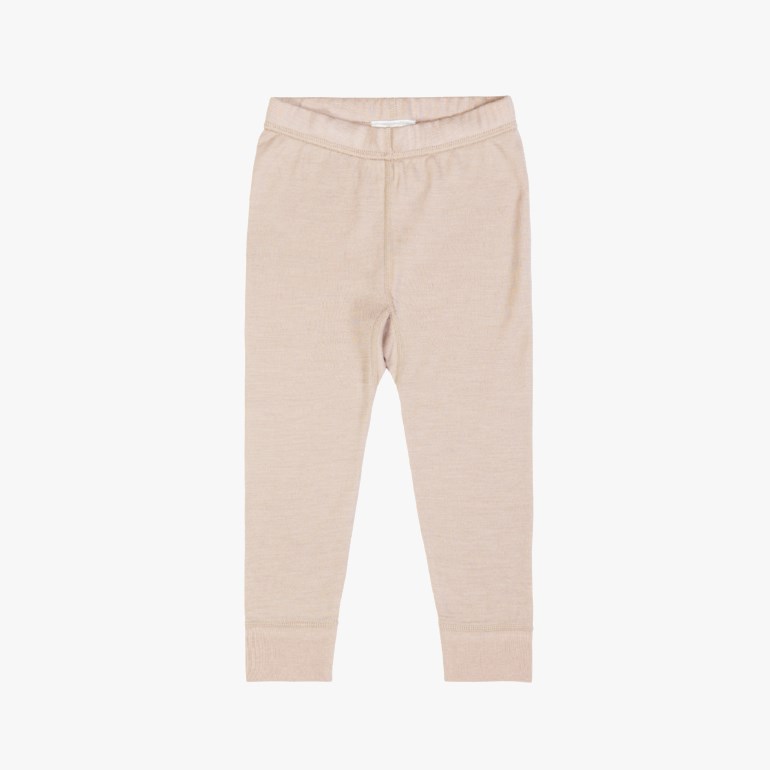 Forfra lysebeige barnleggings med elastisk linning og ribbestrikkede mansjetter.
