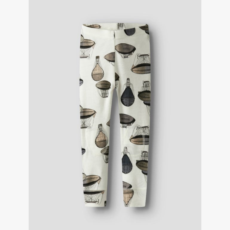 Barnas off-white leggings med et gjentagende mønster av brune og svarte luftballonger, sett forfra.