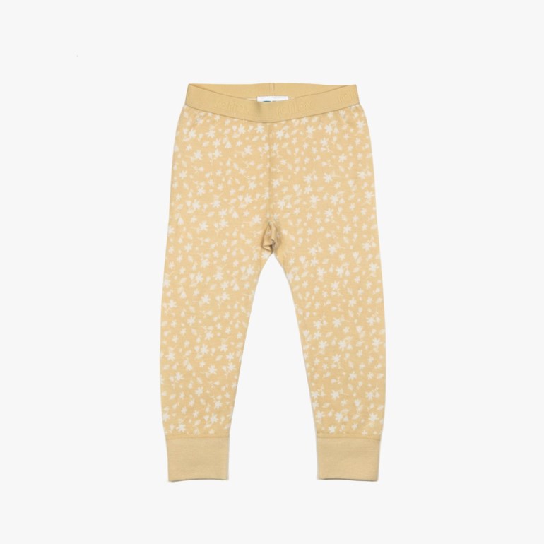 Barnes beige leggings med blomstermønster, ribbekanter og 'reflex' tekst på midjebåndet, forfra.