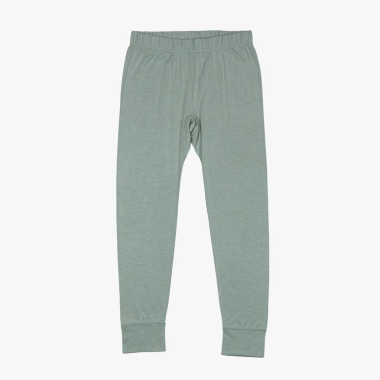 Frontvisning av lysegrønn jerseyleggings med elastisk linning og ribbestrikkede mansjetter på hvit bakgrunn.