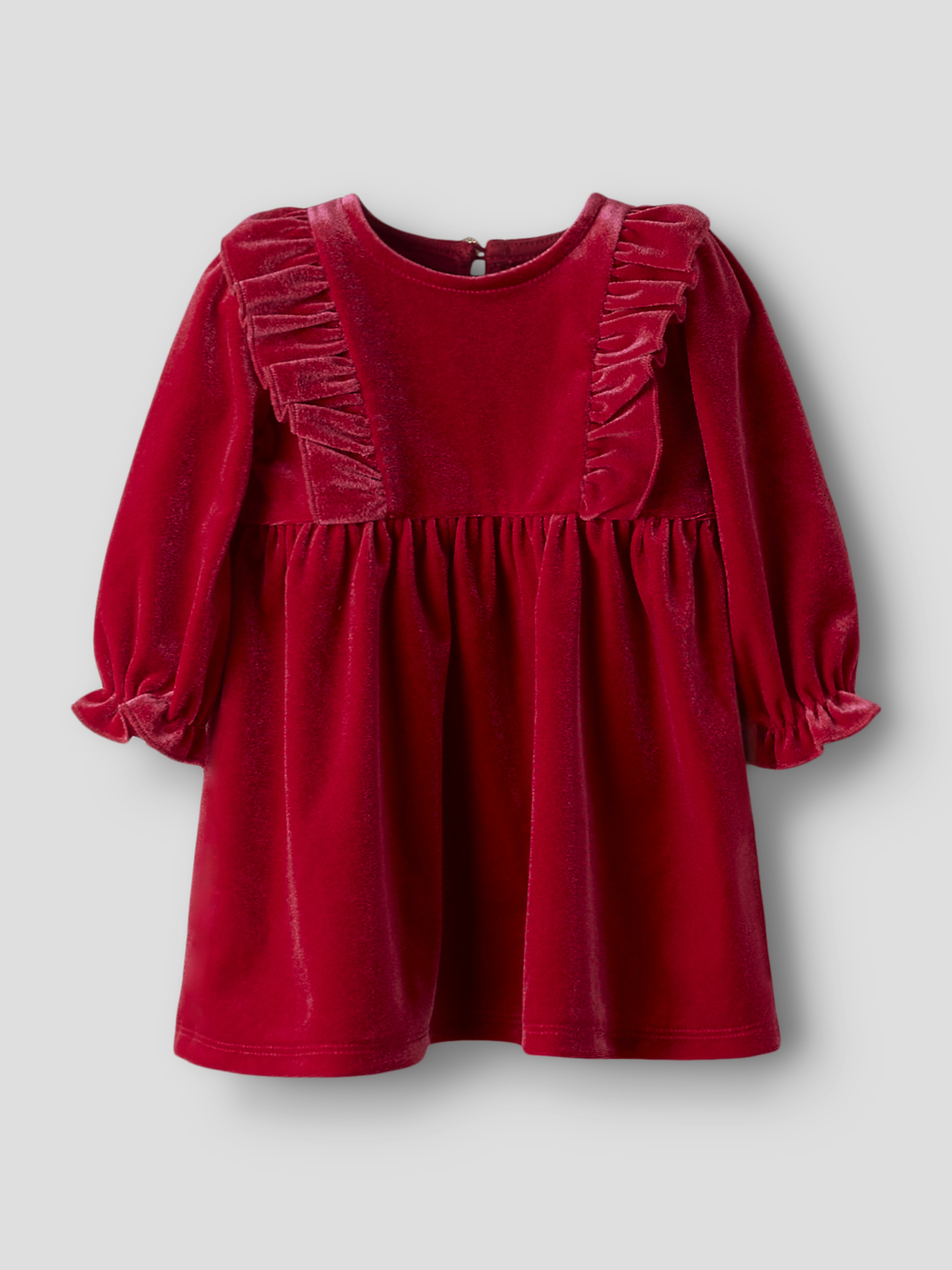 Rød fløyelslangeermet babykjole med rysjer på bolen og elastiske mansjetter.