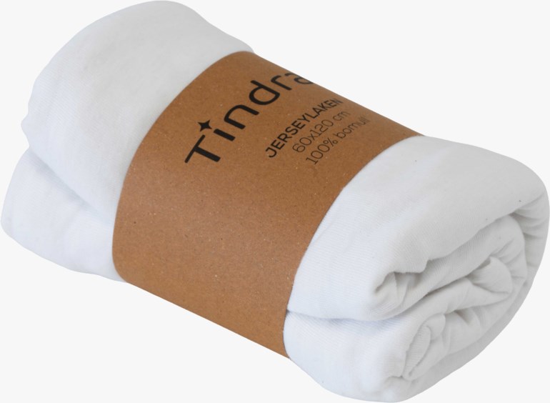 Et hvitt rullet jersey laken med et brunt papirbånd som viser navn og produktdetaljer.
