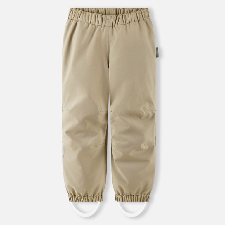 Beige barnebukse med strikk i livet og fotstropper.