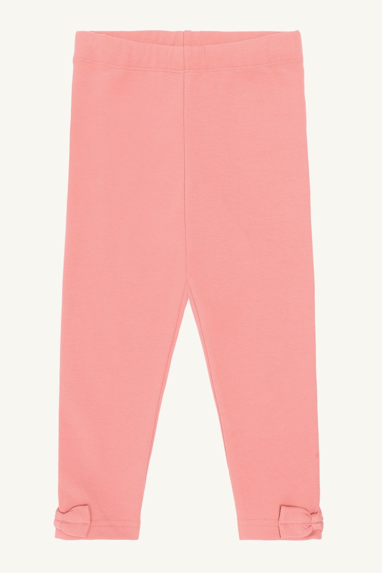 Barns korallrosa leggings med strikk i midjen og små sløyfer ved anklene, forfra.