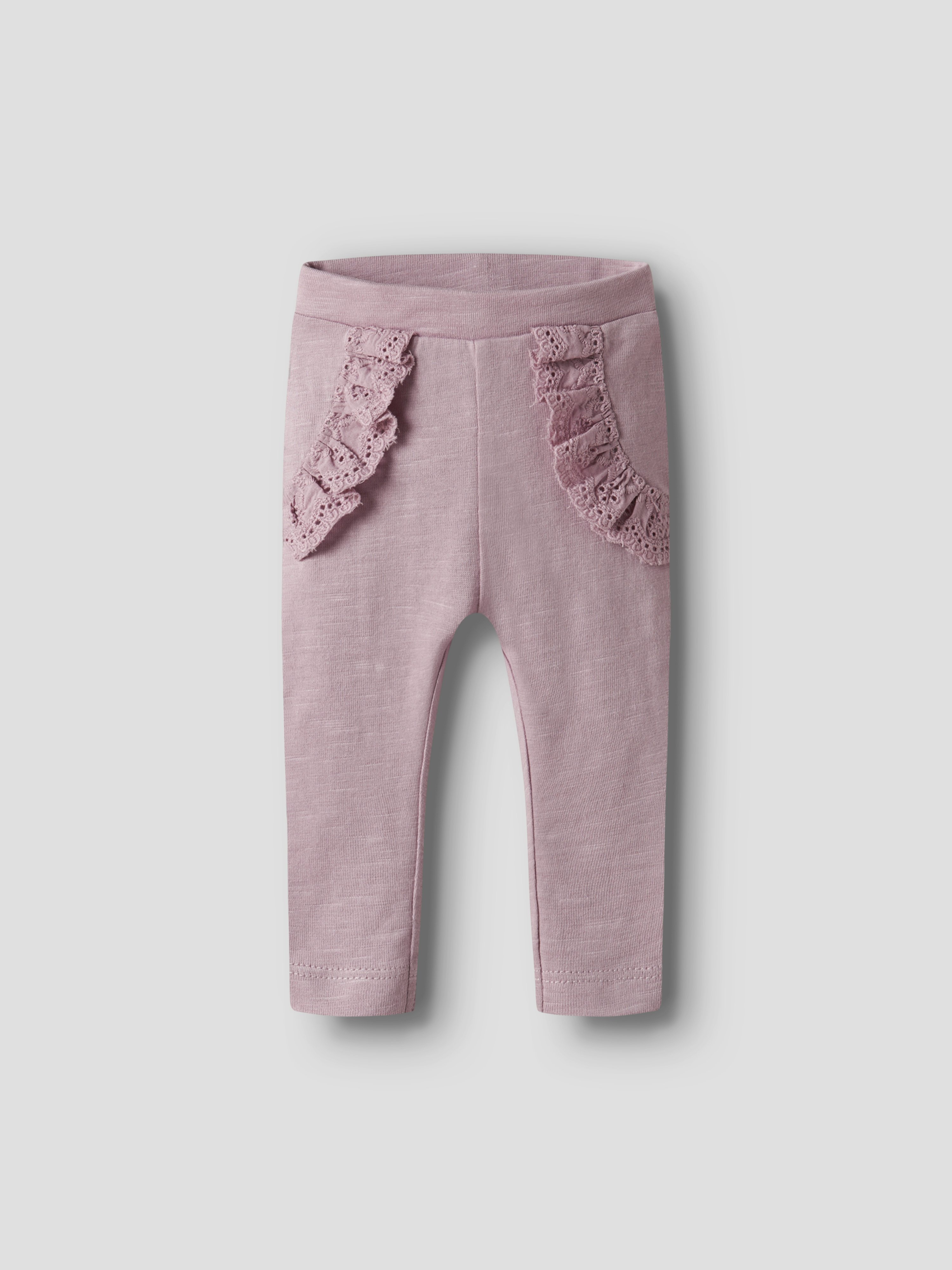 Støvrosa baby leggings med volanger i blondekant på øvre front.