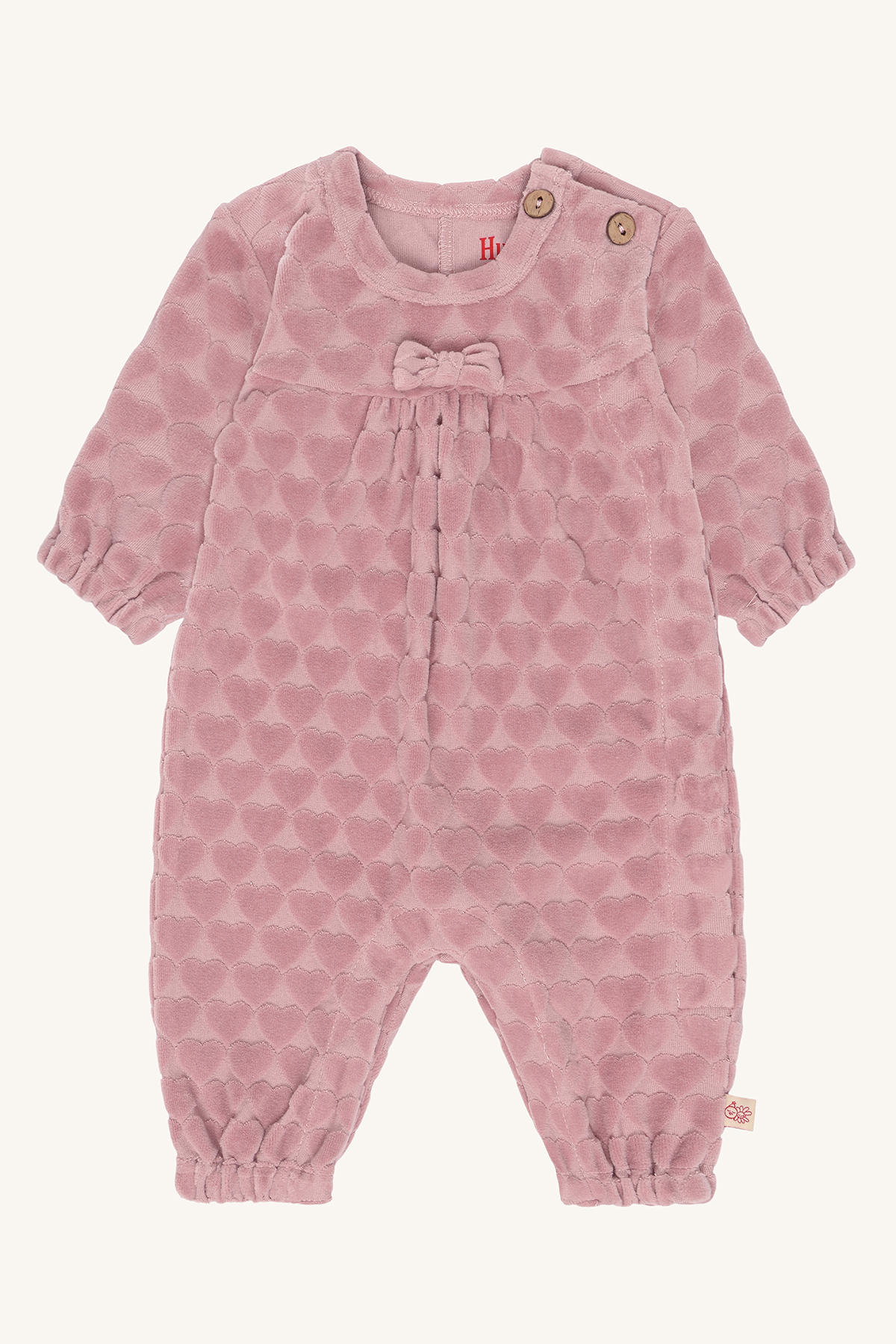 Babyrosa veloursparkedress med pregede hjerter, rund hals, skulderknapper, sløyfe foran og elastiske mansjetter.