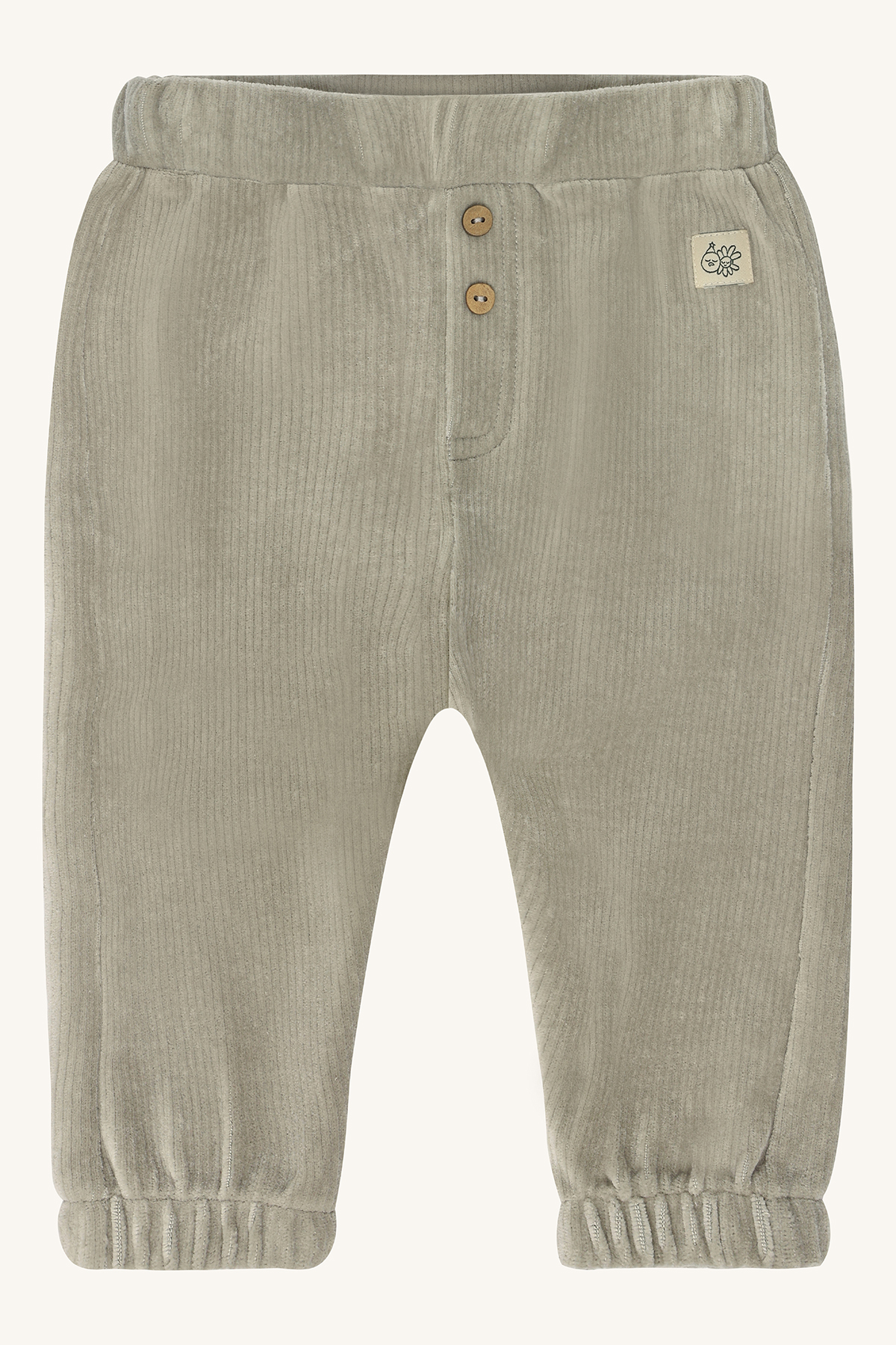 Forfra: babybukse i lys beige kordfløyel med strikk i midjen, to knapper og elastiske benkanter.