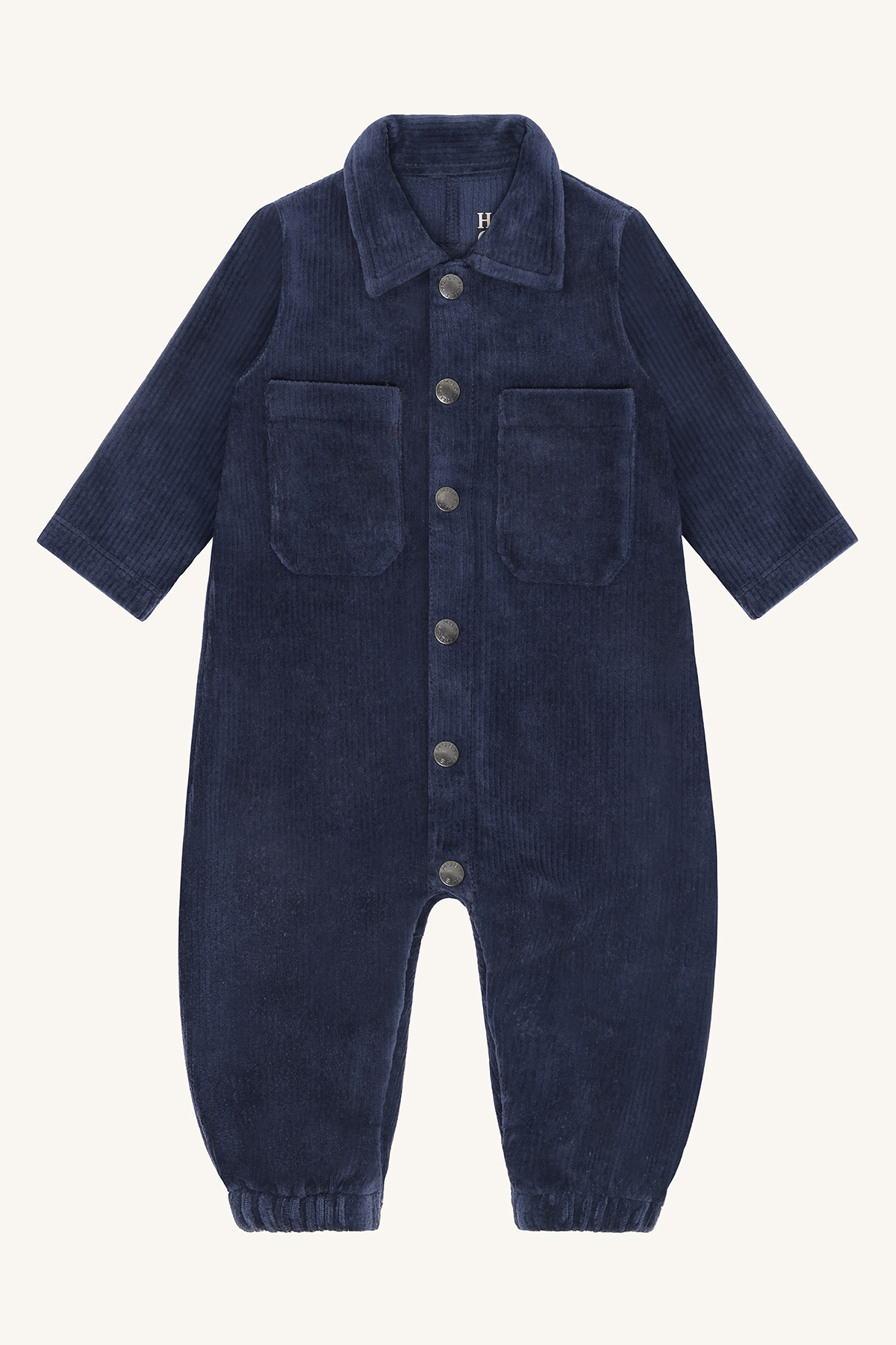 Marineblå kordfløyel sparkebukse for baby med krage, lange ermer, knapper foran og to lommer.