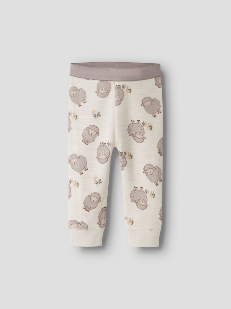 Babyleggings i off-white med grått saue- og blomstermønster, elastisk grå midje og mansjetter ved anklene.