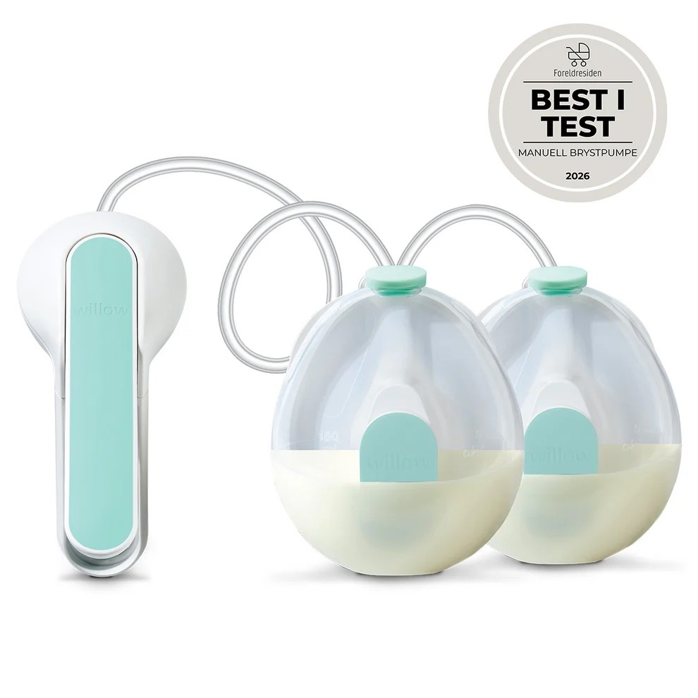 Hvit og mintgrønn dobbel elektrisk brystpumpe, to melkeoppsamlingsflasker og et "BEST I TEST"-merke.