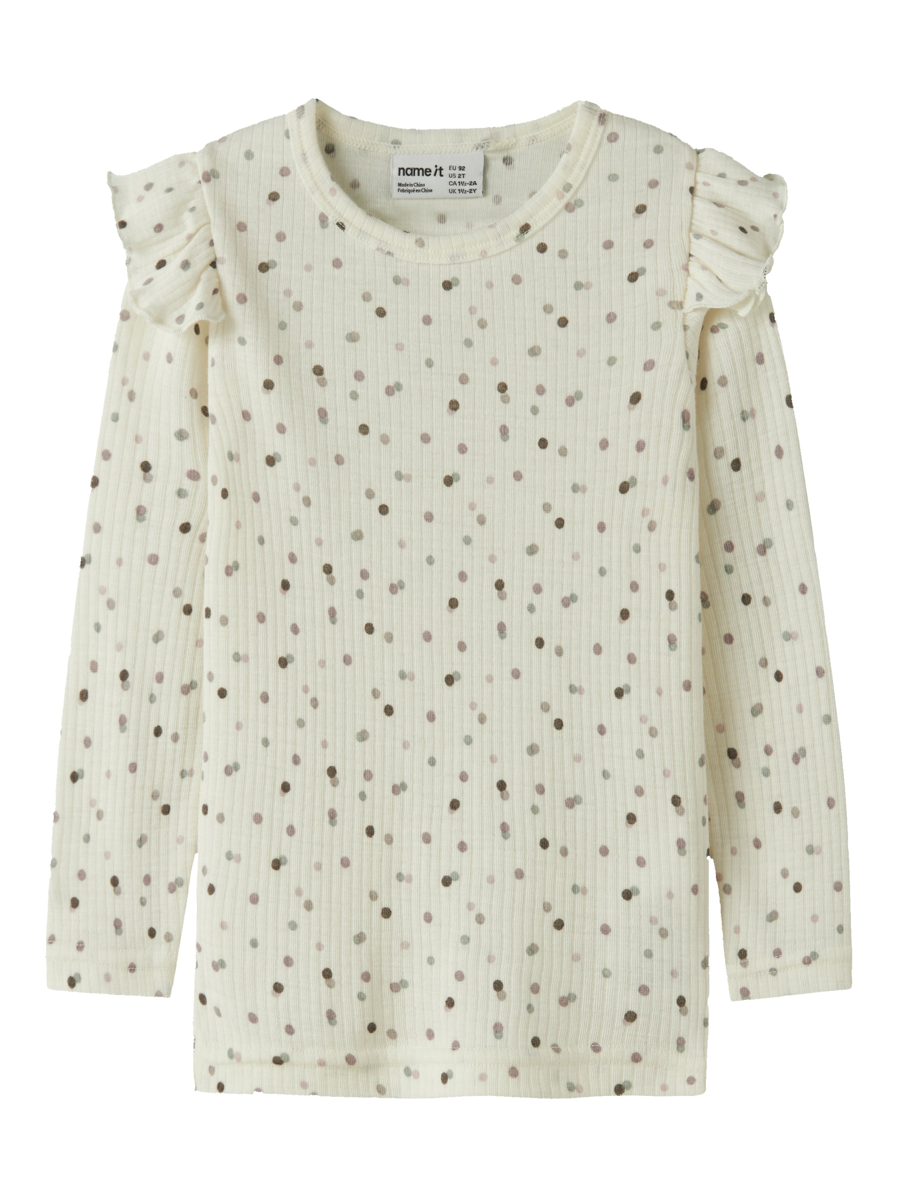 Barns ribbet off-white langermet topp med volanger og brune prikker, forfra.