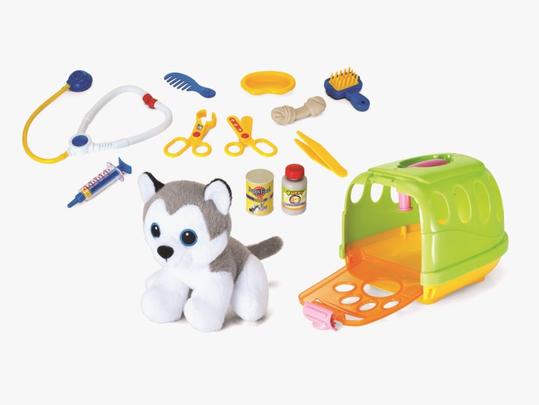 Lekedyresett med en plysjhusky, grønn transportboks, lekeveterinærverktøy, pleietilbehør og matvarer.