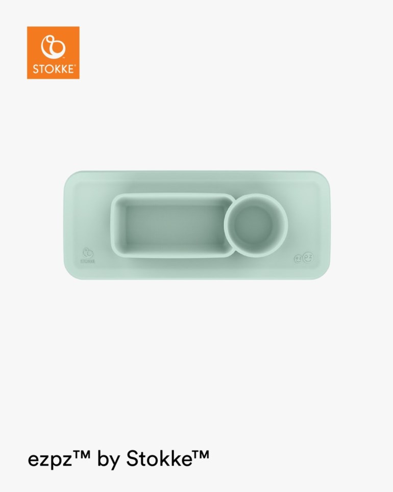 Mintgrønn silikonunderlag med et integrert rektangulært rom og en rund koppholder.