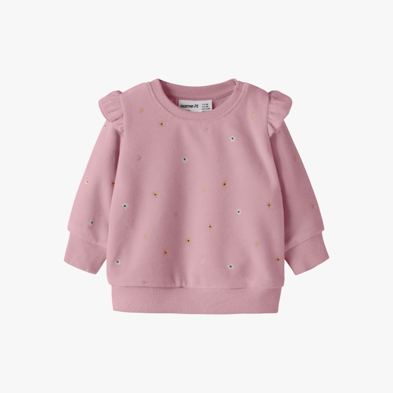Frontvisning av rosa babygenser med volanger på skuldrene og fargerike blomsterbroderier.